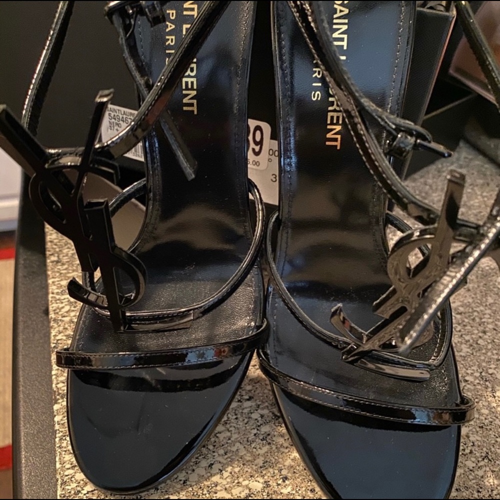 Black YSL open toe heels.